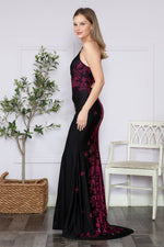 This full-length dress features delicate spaghetti straps and an alluring open back. The dress is adorned with intricate floral and butterfly rain rhinestone details on the back, creating an enchanting design. Choose this dress for your next prom or formal event!  PY 9274