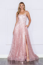 This dress features a straight across neckline with spaghetti straps and a lace-up back. This gown has an A-line silhouette with pockets and unique sequin fabric and a slit. A stunning choice for your next prom or formal event.  PY 9290