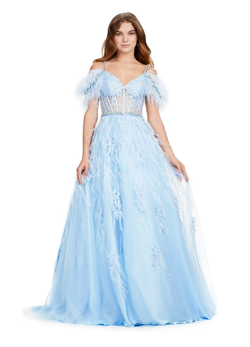 This remarkable ballgown features a cold-shoulder neckline with crystal stone detailed spaghetti straps and a feather off-the-shoulder embellishments. The bodice is partly sheer with corset boning, lace detailing and a crystal stone embellished waistline belt. The feathers and lace continue down through the skirt with an A-line silhouette and tulle fabric. This dress is a magical choice for your next prom or formal event.  Ashley Lauren 11447