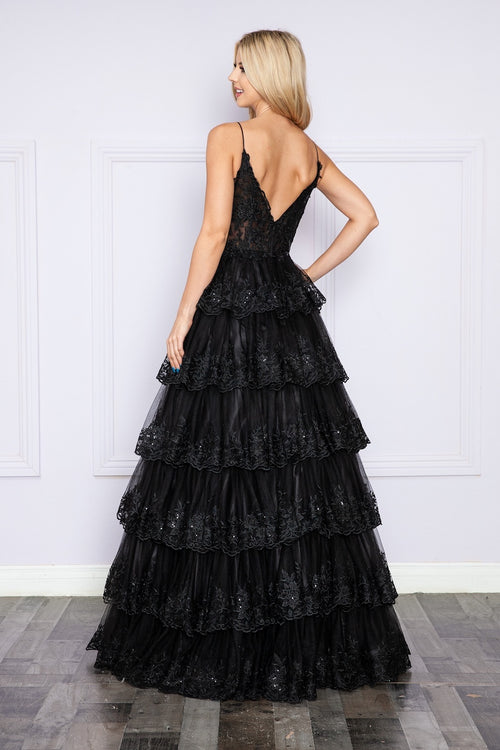 This dress features a sheer bodice with corset boning, a v-back, lace detailing on the bodice and a tiered skirt with lace detailing on the hemlines of each tier. This dress is feminine and romantic and could be just the vibe for your next prom or formal event.   PY 9402