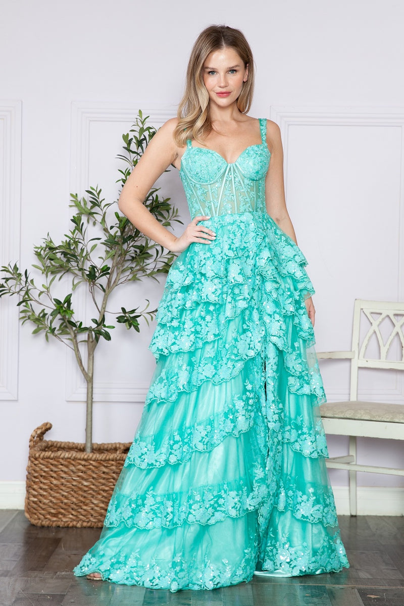 This dress features a lace corset bodice with exposed boning, an A-line silhouette with a ruffle-tiered skirt and slit. This dress is feminine and ethereal and could be just the vibe for your next prom or formal event.  PY 9410