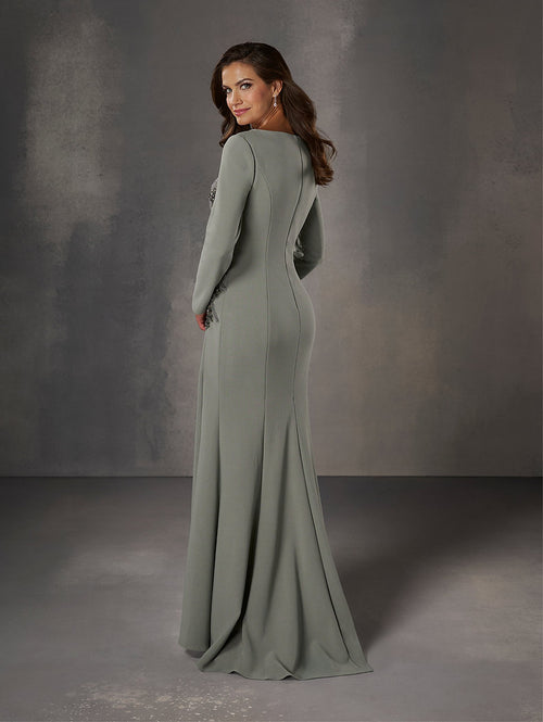 This dress features an asymmetrical neckline with long sleeves and a covered back, beaded detailing on the torso and a fitted silhouette with a skirt slit.

HOW 17253