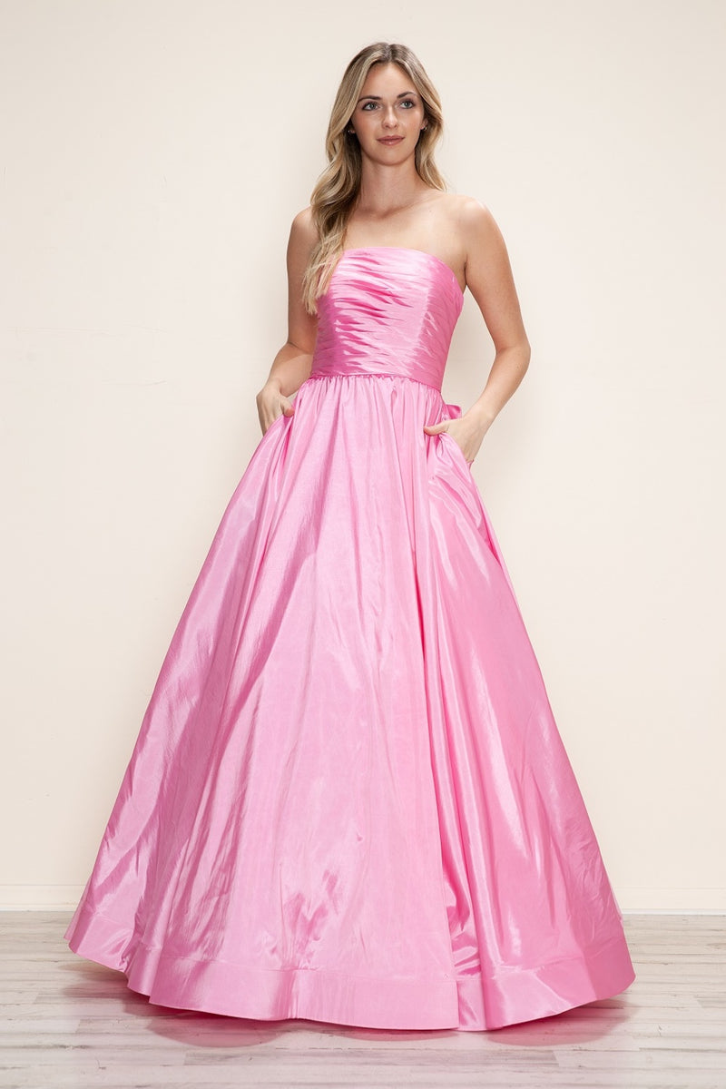 This dress features a strapless neckline with a ruched bodice, a lace-up back with a bow. The taffeta fabric pairs well with the A-line silhouette and pockets for convenience. Style this dress to make it your own at your next prom or formal event.

PY 9754