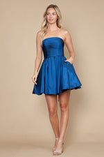 This dress features a strapless neckline with a ruched bodice, a lace-up back with a dramatic bow in the back. The A-line silhouette creates a playful vibe and could be ideal for your next homecoming or formal event.

PY 9908