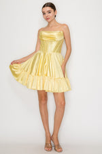 This cocktail dress features a strapless neckline with ruched detailing on the bust, with a corset style bodice with hot-stones throughout the fabric. The A-line skirt has a hem detail that creates a fun design detail.&nbsp;

PY 9942