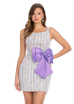 This cocktail dress features a multi colored tweed fabric, a square neckline and large taffeta bow with a fitted silhouette.&nbsp;

Ashley Lauren 4799
