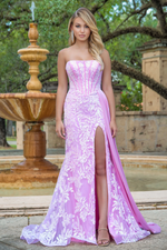This dress features a strapless neckline, a bodice with corset boning, sequin fabric with a floral pattern, a side slit, and a charmeuse side drape train. This dress is glamorous and flattering and could be ideal for your next prom or formal event.   ARY 28291