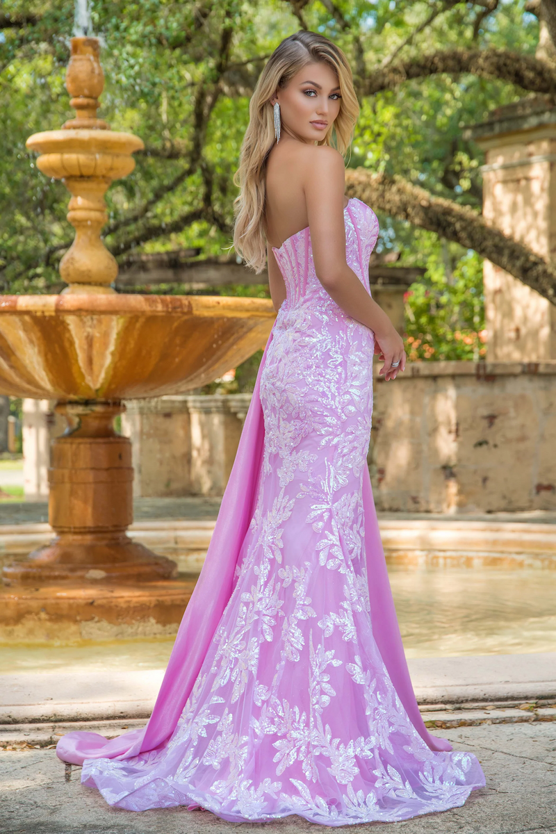 This dress features a strapless neckline, a bodice with corset boning, sequin fabric with a floral pattern, a side slit, and a charmeuse side drape train. This dress is glamorous and flattering and could be ideal for your next prom or formal event.   ARY 28291