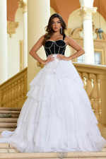 This ballgown features a sweetheart neckline with 1-inch straps, and a corset bodice with bead trim detailing as an outline to accentuate the corset. The skirt has layered glitter tulle fabric that creates volume. This dress is unique and a fashion-forward choice for your next prom or formal event.   ARY 28592