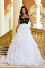 This ballgown features a sweetheart neckline with 1-inch straps, and a corset bodice with bead trim detailing as an outline to accentuate the corset. The skirt has layered glitter tulle fabric that creates volume. This dress is unique and a fashion-forward choice for your next prom or formal event.   ARY 28592