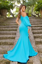 This dress features an asymmetrical neckline with a one-shoulder and an off-the-shoulder long puff sleeve with a crystal-embellished cuff. This dress has a fitted silhouette with a slit and a slight train. It is architectural and unique and could be a great choice for your next prom, pageant or formal event.   ARY 38352