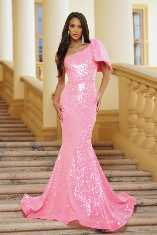 This dress features a one-shoulder neckline with a bow detail. This dress is fully sequined with a fitted silhouette and a slight train. This dress has the perfect amount of details to stand out at your next prom or formal event.  ARY 39286