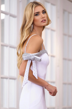 This dress features a one-shoulder neckline that falls off the shoulder with a bow detail embellished with crystal beading. The fitted silhouette has a slight train with a slit in the skirt. This dress is elegant and gives red carpet-vibes. This could be just the look for your next prom, pageant or formal event.  ARY 39304