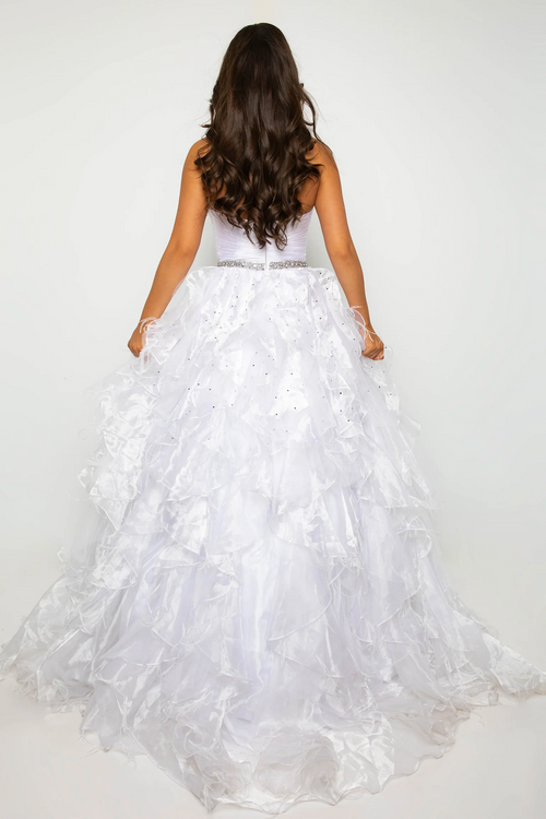 This gown features a strapless neckline with a ruched bodice, a jeweled waistband, and a layered voluminous skirt. This dress is classic and could be styled to make it your own at your next prom, pageant or formal event.  ARY 39555