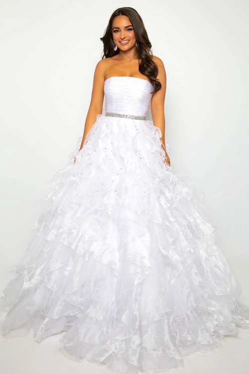 This gown features a strapless neckline with a ruched bodice, a jeweled waistband, and a layered voluminous skirt. This dress is classic and could be styled to make it your own at your next prom, pageant or formal event.  ARY 39555