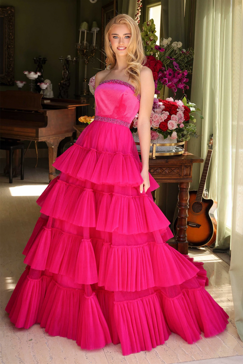 This strapless ballgown features a beaded neckline and belt, and a tiered tulle skirt and a dramatic train. This dress is classic but also unique and could be ideal for your next prom, pageant or formal event.  ARY 29529