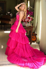 This strapless ballgown features a beaded neckline and belt, and a tiered tulle skirt and a dramatic train. This dress is classic but also unique and could be ideal for your next prom, pageant or formal event.  ARY 29529