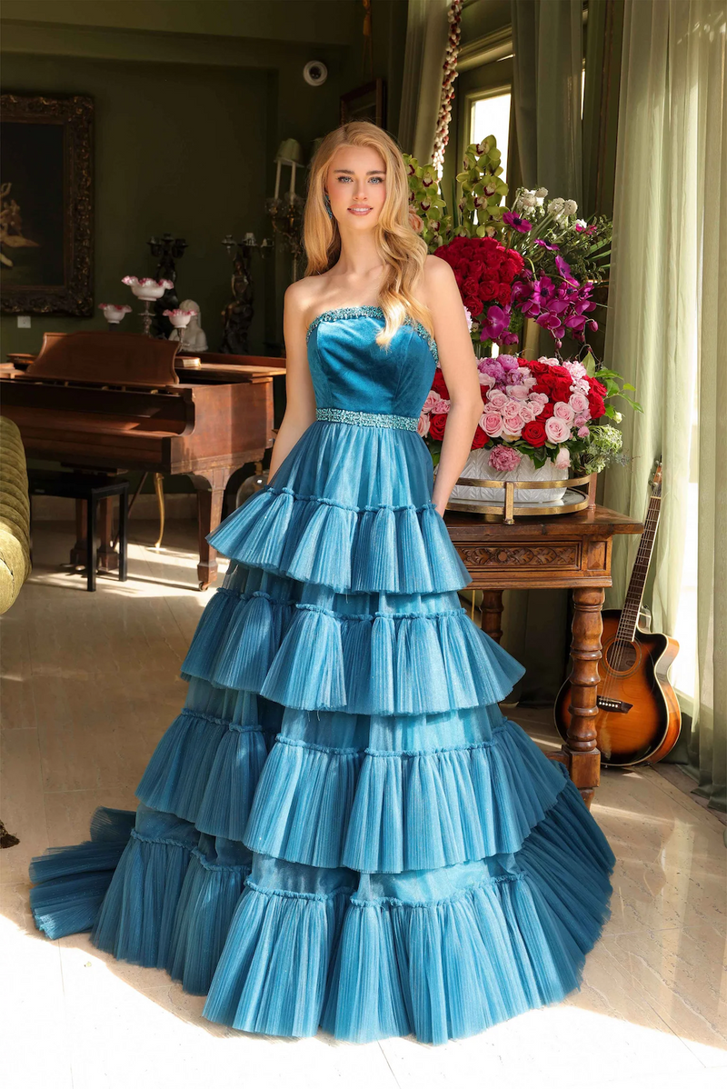 This strapless ballgown features a beaded neckline and belt, and a tiered tulle skirt and a dramatic train. This dress is classic but also unique and could be ideal for your next prom, pageant or formal event.  ARY 29529