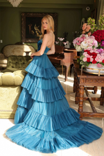 This strapless ballgown features a beaded neckline and belt, and a tiered tulle skirt and a dramatic train. This dress is classic but also unique and could be ideal for your next prom, pageant or formal event.  ARY 29529