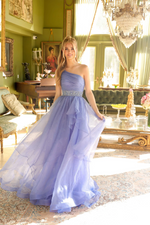 This dress features a one-shoulder design with a beautifully draped bodice and a sparkling waistband that cinches at the waist, creating a flattering silhouette. The flowing skirt is adorned with subtle embellishments, perfect for making a graceful statement at your next formal event.

ARY 29534