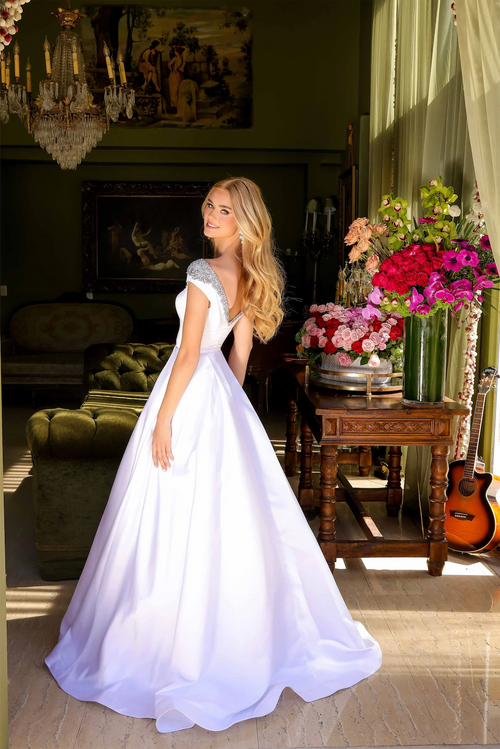 This satin gown features a beaded neckline and elegant cap sleeves. The A-line silhouette creates volume and drama. It's an ideal choice for those looking to shine at your prom, pageant or formal event.

ARY 39322