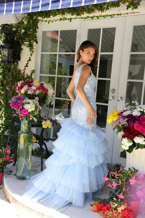 This dress features a one-shoulder neckline with a bodice crafted from lace fabric that adds a touch of sparkle.&nbsp;The skirt features layers of tiered tulle ruffles that cascade down, creating a voluminous silhouette. Perfect for formal events, this dress is ideal for your next prom or pageant.

ARY 29254