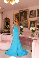 This dress features an off-the-shoulder neckline with beaded detailing complementing the pleated bodice.&nbsp;The dress includes a side slit, which adds a dramatic element to the otherwise classic silhouette, allowing for ease of movement. This gown is perfect for prom, formal events, galas, or any special occasion where a bold, eye-catching look is desired.

ARY 40022