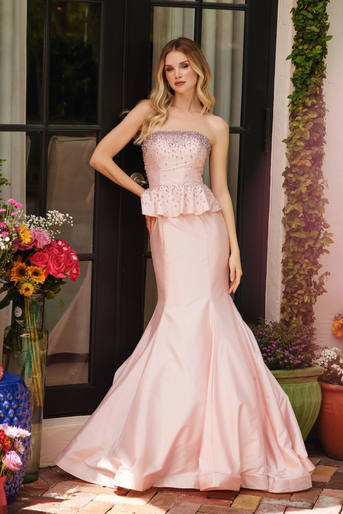 This strapless dress features a fitted bodice embellished with intricate beading. A peplum detail at the waist enhances the silhouette, creating a flattering hourglass shape. The gown flows into a mermaid-style skirt, flaring out toward the hem. Perfect for formal events such as prom, or your next pageant.

ARY 40092