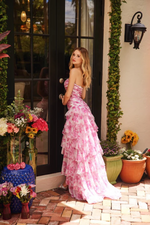 This dress features a strapless sweetheart neckline with a ruched drop waistline. The skirt has layered tiers giving volume and movement. This dress is effortless and a stunning choice for your next prom or formal event.

ARY 40027