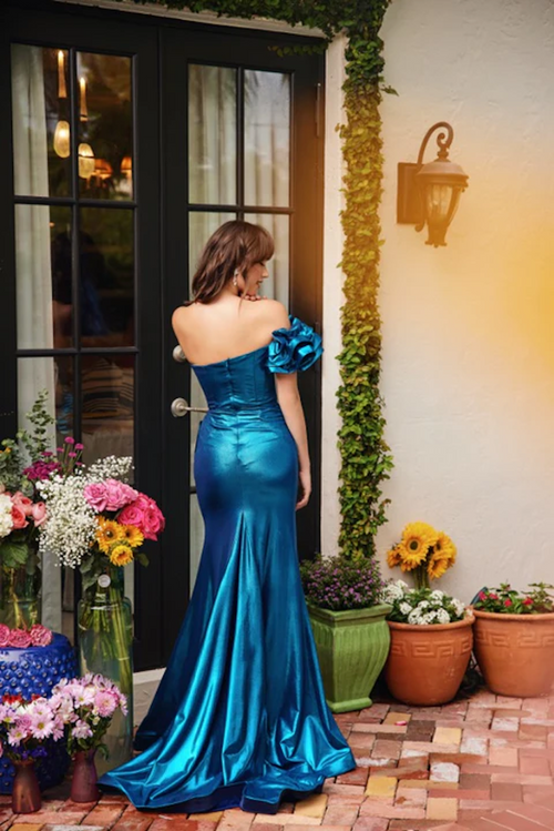 This dress features a strapless neckline with a fitted bodice. This gown is characterized by its timeless silhouette and luxurious fabric, which drapes beautifully to create a refined look. The side slit in the skirt and the dramatic ruffle one-shoulder sleeve add a contemporary touch, giving the gown a balance of classic elegance and modern style. Style this dress to make it your own at your next prom or formal event.

ARY 40082