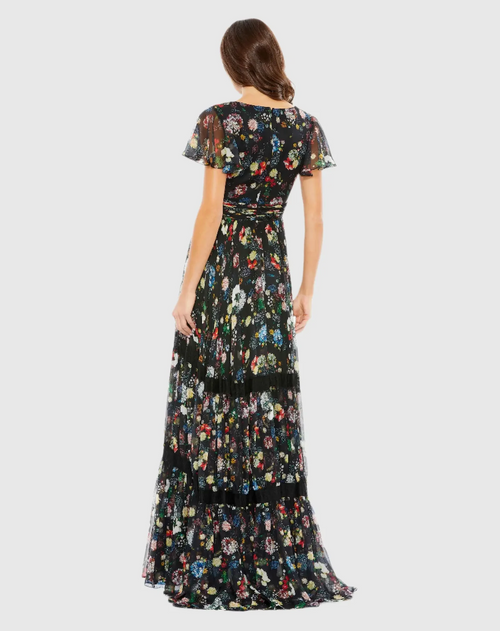 This floral print pleated wrap butterfly sleeve maxi dress features a floral print and flattering pleats, with a V-neckline and a cap sleeve. Style this dress to make it your own at your next prom or formal event.

Mac Duggal 67934