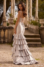This Sherri Hill gown features a mermaid silhouette, corset top, deep v neck line, lace up back and ruffled skirt and slit. Pair this dress with fun heels for a trendy prom or formal event look.

Sherri Hill 57146