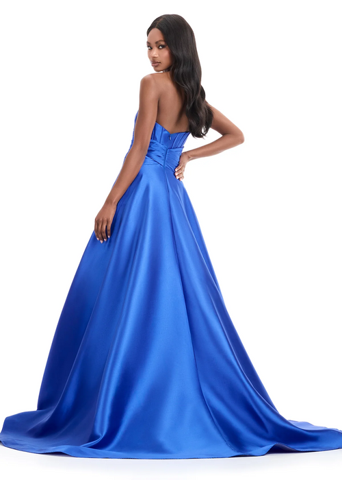 This gown features a strapless neckline with mikado fabric, and a structured bodice featuring a pleated waist detail. This dress may be perfect for your next prom, pageant or formal event.

Ashley Lauren 12055