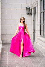 This Sherri Hill gown features a rich metallic pleated fabric with key hole bodice, braided straps and high skirt slit. With a fitted waistline and lightweight fabric, this dress is ideal for your next prom of formal event!

Sherri Hill 55930
