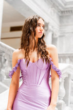 This Sherri Hill gown features silky stretch satin fabric with a corset top, and rosette embellished straps. This dress has a fitted silhouette with a slight train, it is feminine and sophisticated and may be ideal for your next prom or formal event.

Sherri Hill 56090