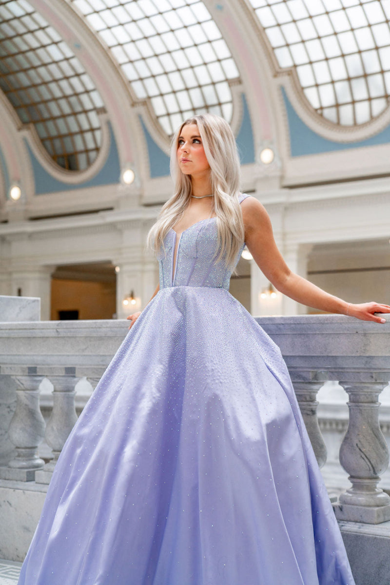 This Sherri Hill ballgown features mikado fabric with hotfix jewels and a deep V illusion bodice. The crochet-style lace-up back allows for the perfect fit. This may be the ideal choice for your next prom or formal event.&nbsp;

Sherri Hill 56106