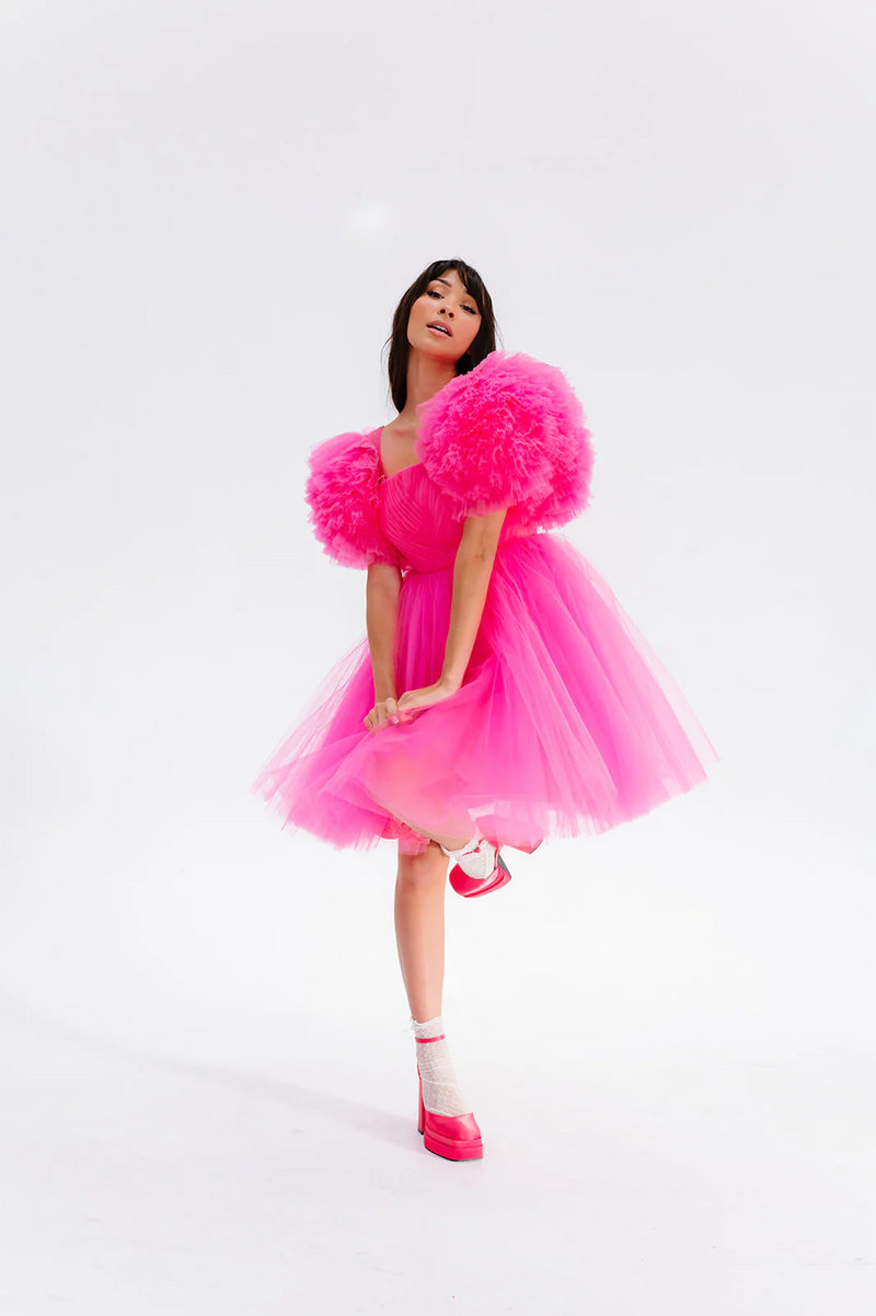 This cocktail dress features soft tulle fabric, fully boned corset and built-in pads, a pleated bodice, mini layered skirt, puffy ruffled sleeves, and a lace-up back. This is a playful choice for your next homecoming or formal event.

AG 11007