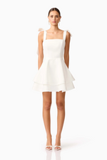 Cut from structured&nbsp;duchess satin, this crisp mini dress is fully lined for a smooth, supportive fit. The&nbsp;straight neckline&nbsp;lends a clean, minimalist silhouette, while the&nbsp;adjustable tie straps&nbsp;allow for a personalised, delicate touch. Choose this cocktail dress for your next homecoming or formal event.

ELT E3092548