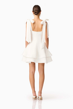 Cut from structured&nbsp;duchess satin, this crisp mini dress is fully lined for a smooth, supportive fit. The&nbsp;straight neckline&nbsp;lends a clean, minimalist silhouette, while the&nbsp;adjustable tie straps&nbsp;allow for a personalised, delicate touch. Choose this cocktail dress for your next homecoming or formal event.

ELT E3092548