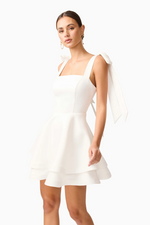 Cut from structured&nbsp;duchess satin, this crisp mini dress is fully lined for a smooth, supportive fit. The&nbsp;straight neckline&nbsp;lends a clean, minimalist silhouette, while the&nbsp;adjustable tie straps&nbsp;allow for a personalised, delicate touch. Choose this cocktail dress for your next homecoming or formal event.

ELT E3092548