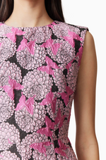 This cocktail dress features a luxe jacquard fabrication with butterfly and floral details throughout the fabric, a high neckline and covered back with an A-line silhouette. Style this dress to make it your own at your next homecoming or formal event.

ELT E6022502