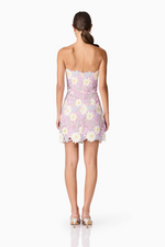 This strapless cocktail dress features a straight neckline, scalloped edge detailing at the neckline and hemline for softness. It is crafted from textured guipure lace fabrication and fully lined for coverage and comfort for your next homecoming or formal event.

ELT EC2082502