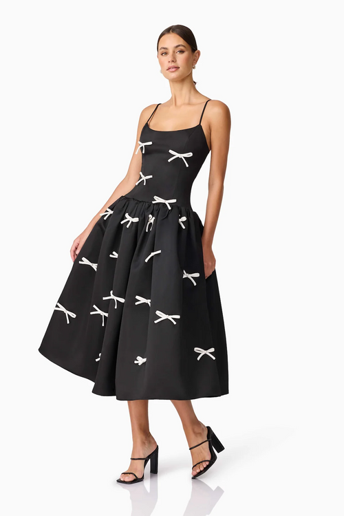 This cocktail dress features a duchess satin fabric, a curved neckline with adjustable straps, a gathered skirt at the waist seam for volume, a fit and flare silhouette, and 3D bows with pearl embellishment. This dress is unique and playful and could be ideal for your next homecoming or formal event.

ELT&nbsp;EC2082539