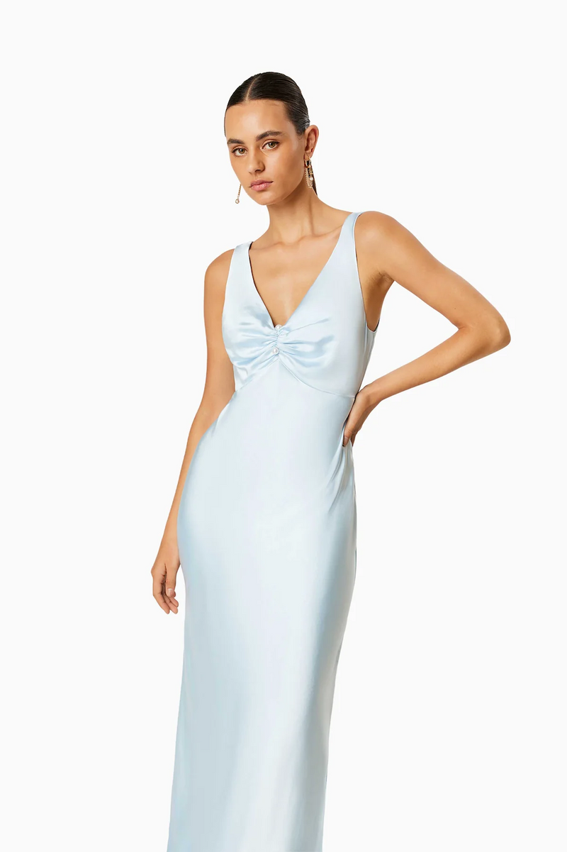This midi slip dress features a plunge neckline with a gathered front, gold hardware and luxe satin fabrication. This dress is effortless and could be perfect for your next homecoming, or formal event.   ELT EC8052421