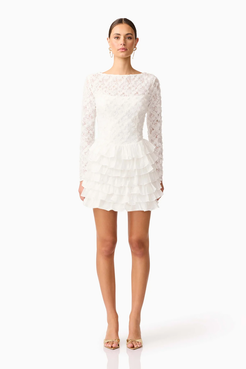 This long sleeve mini dress with a fitted silhouette features frills on the hip for a soft, sculptural accent with lace/tencel organza fabrication for texture. This modest cocktail dress is an excellent choice for your next homecoming or formal event.

ELT EH3092540
