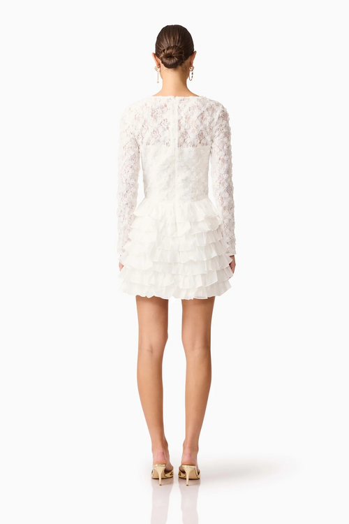 This long sleeve mini dress with a fitted silhouette features frills on the hip for a soft, sculptural accent with lace/tencel organza fabrication for texture. This modest cocktail dress is an excellent choice for your next homecoming or formal event.

ELT EH3092540