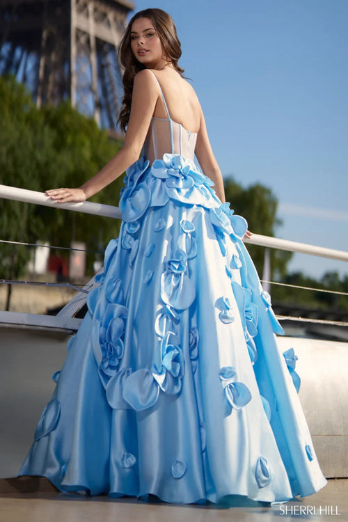 This show stopping Sherri Hill gown features a ball gown silhouette, mikado fabric, sheer corset bodice and 3D floral embellishments on the skirt. Pair this dress with some dainty heels for the perfect prom look.

Sherri Hill 56763
