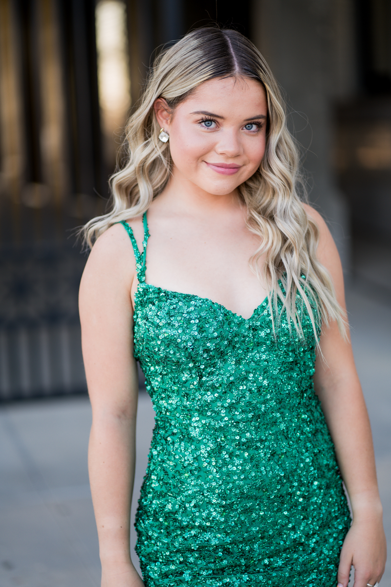 Glam up your next homecoming dance in Kendelyn! This glittery sequin dress features a lace-up back to show off just the right amount of your glittery self. Feel sparkly and shine radiantly at your next homecoming, sweethearts or formal event.  Ashley Lauren 4625