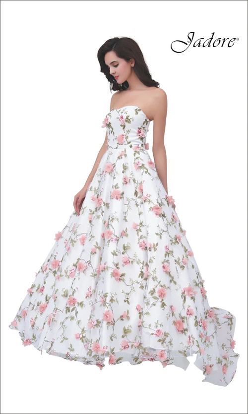 This dress features a strapless neckline with floral embroidery and 3D floral applique. This gown has an A-line silhouette with a voluminous skirt. This gown is ethereal and ideal for your next prom or formal event.  JAD J11343