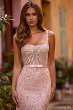 Lace fitted gown with scoop neckline and sheer corset bodice.    

